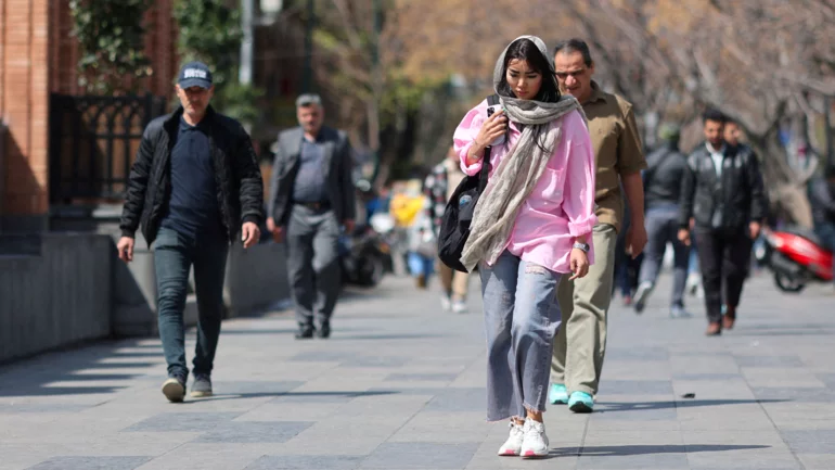 Anxious Iranians hope nuclear talks may ease risk of US attack