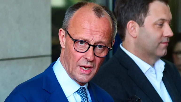 Exclusive-Fearing further market meltdown, Germany's Merz calls for swift action on tariffs