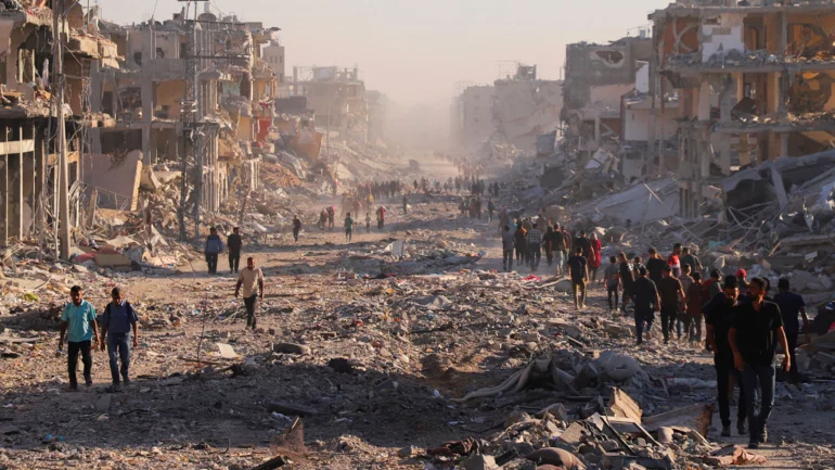 Gazans stream towards wrecked homes as Israeli forces pull back under ceasefire