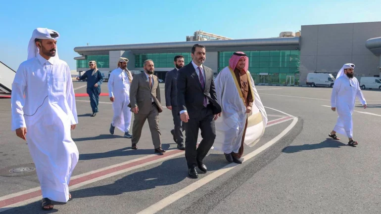 Syria's new Islamist rulers urge US to lift sanctions during visit to Doha