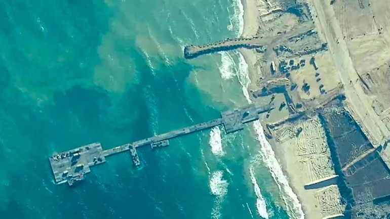 Aid trucks begin moving ashore via Gaza pier, US says