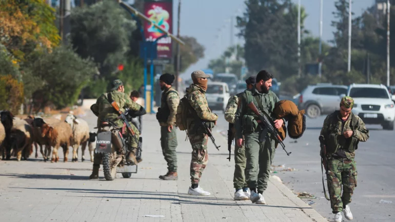 Syrian rebels sweep into Aleppo, army says dozens of soldiers killed